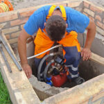 removing submersible well pump